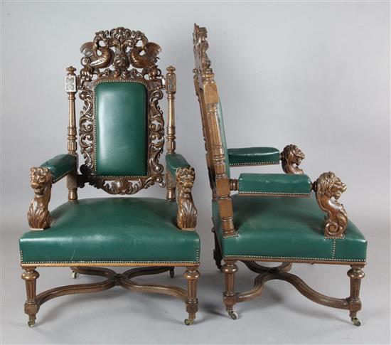 A pair of late Victorian carved oak armchairs, W.2ft 6in. D.2ft 4in. H.4ft 3in.